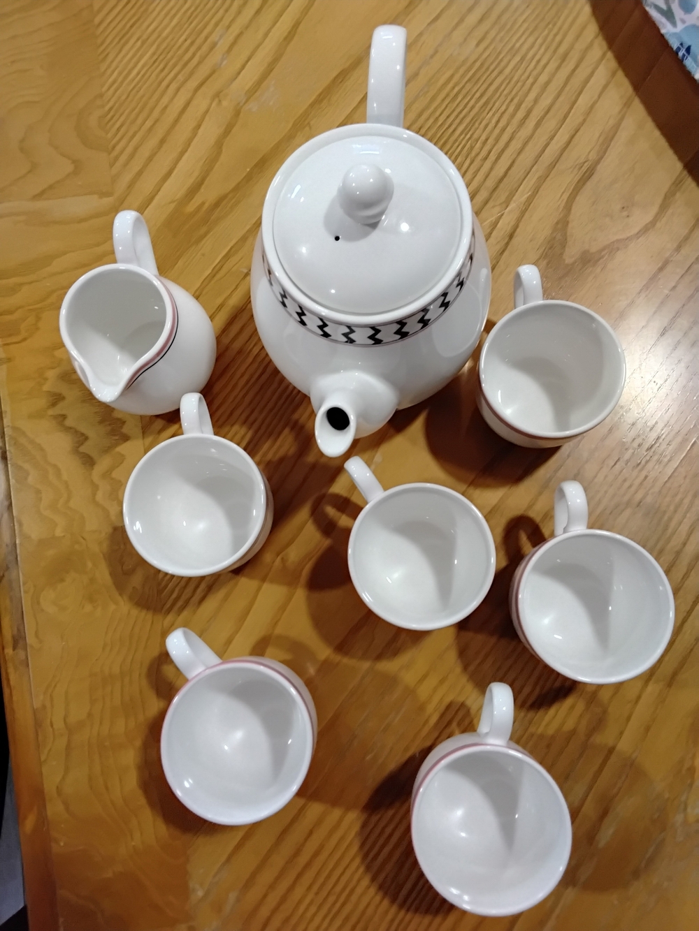 White Ceramic Teapot and Cup Set with Subtle Pink Trim